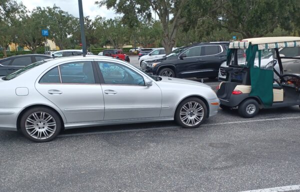 This silver Mercedes parked in a golf cart at a shopping plaza in The Villages.