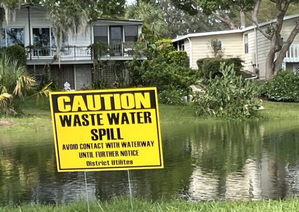 Signs indicate there was a wastewater spill at Lake Paradise