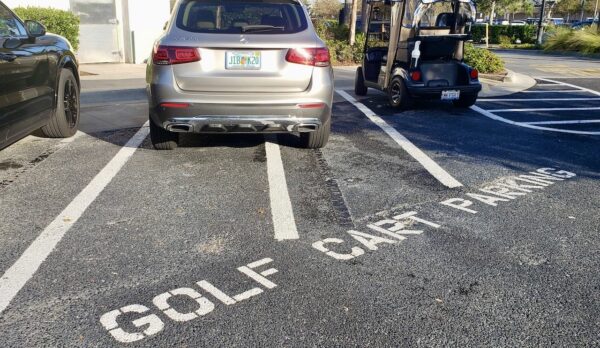 This Mercedes Benz was parked in designated golf cart parking at McDonald s at Colony Plaza