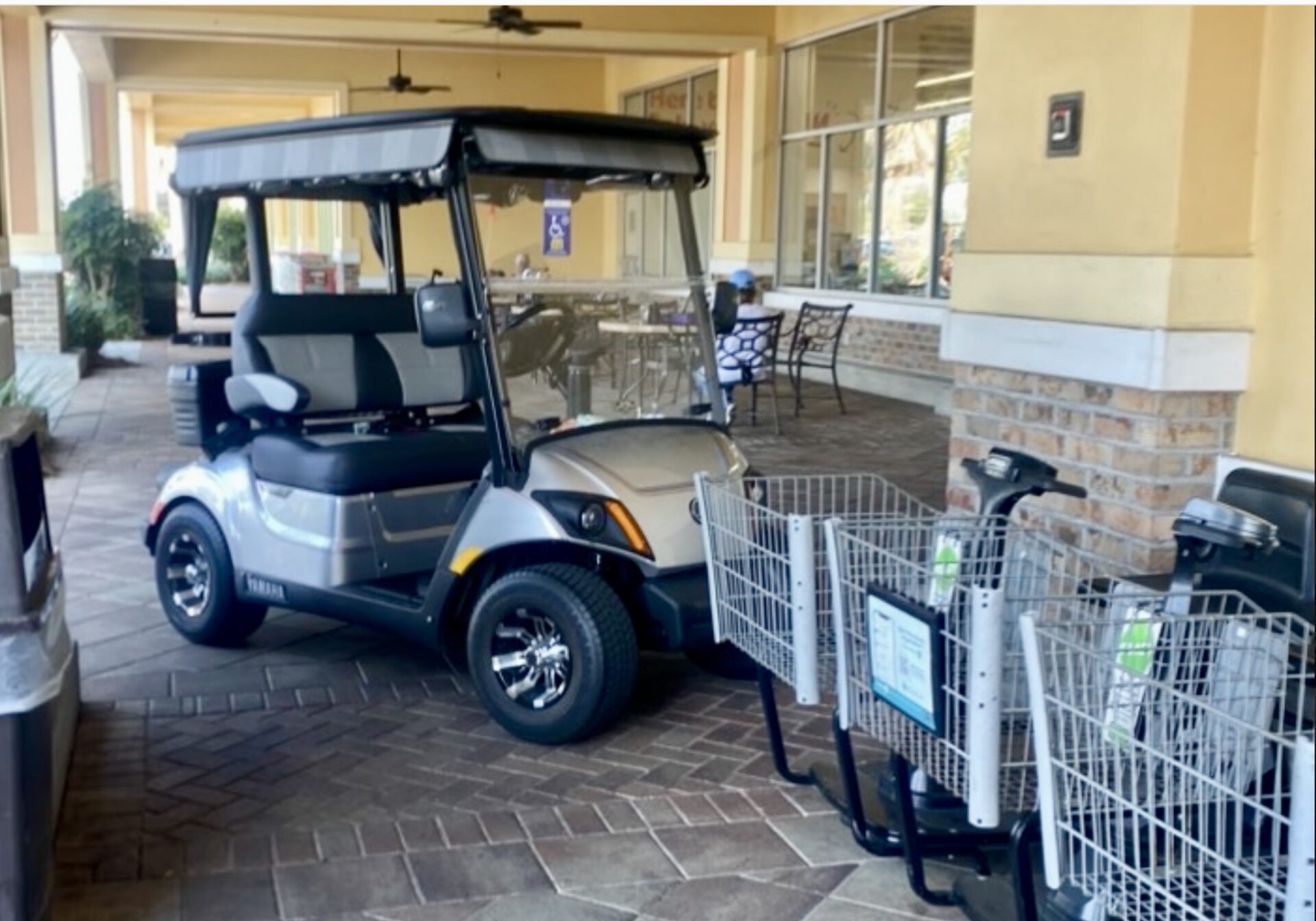 Golf cart tries to blend in with motorized shopping carts