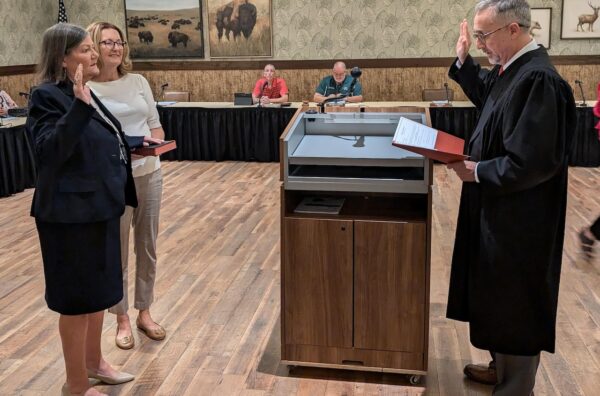 Deb Butterfield, left, was swon in by Judge Paul Militello