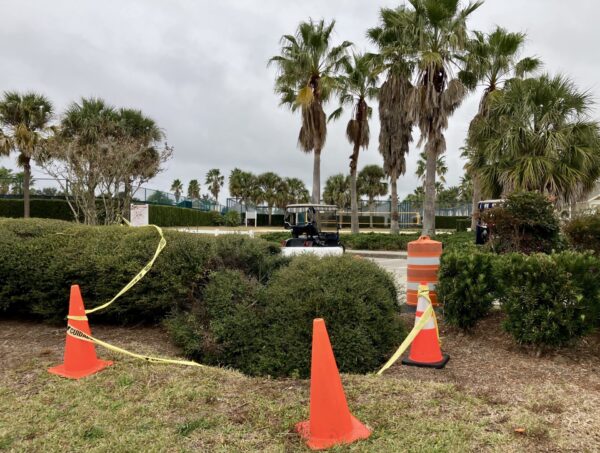 Yellow tape and orange cones mark off the sinkhole at SeaBreeze Recreation Center