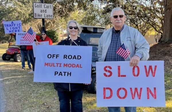 Laurie Clewell and Ralph Sudina joined in the demonstration on Morse Boulevard