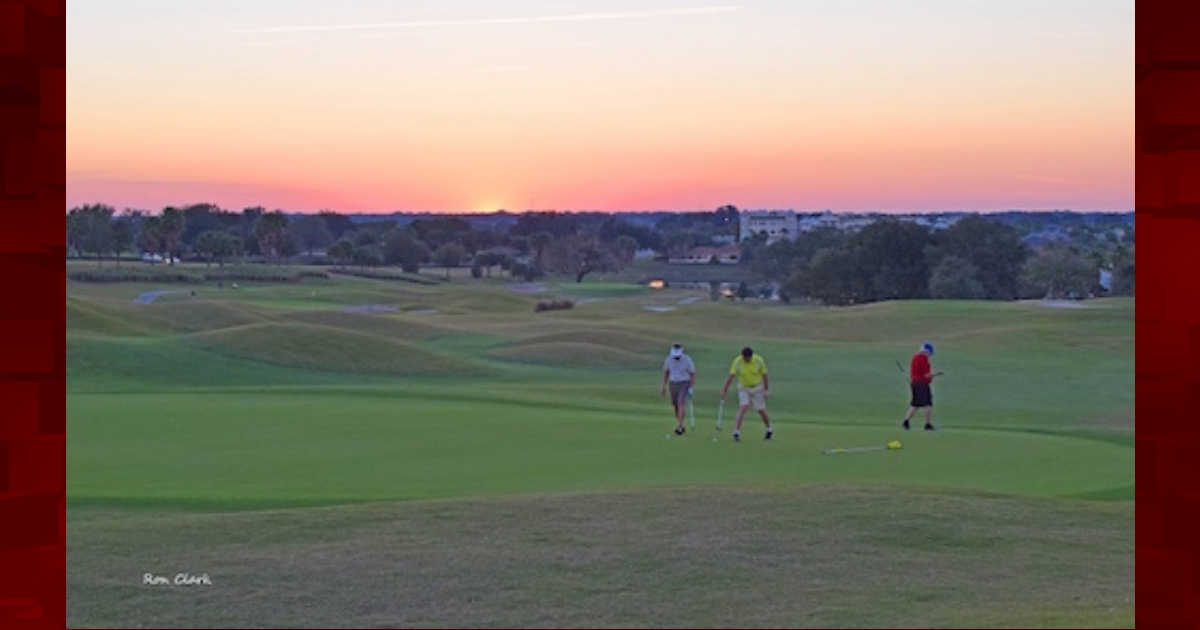 Golfers at sunset on Truman Executive Golf Course